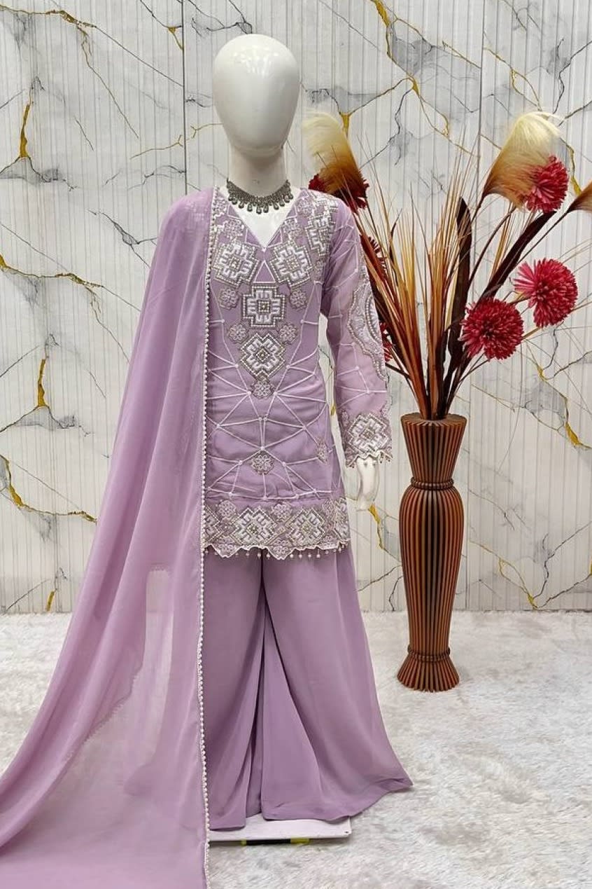 Light purple ethnic kidswear kurta set for girls, three-quarter view, embroidered neckline on georgette.
