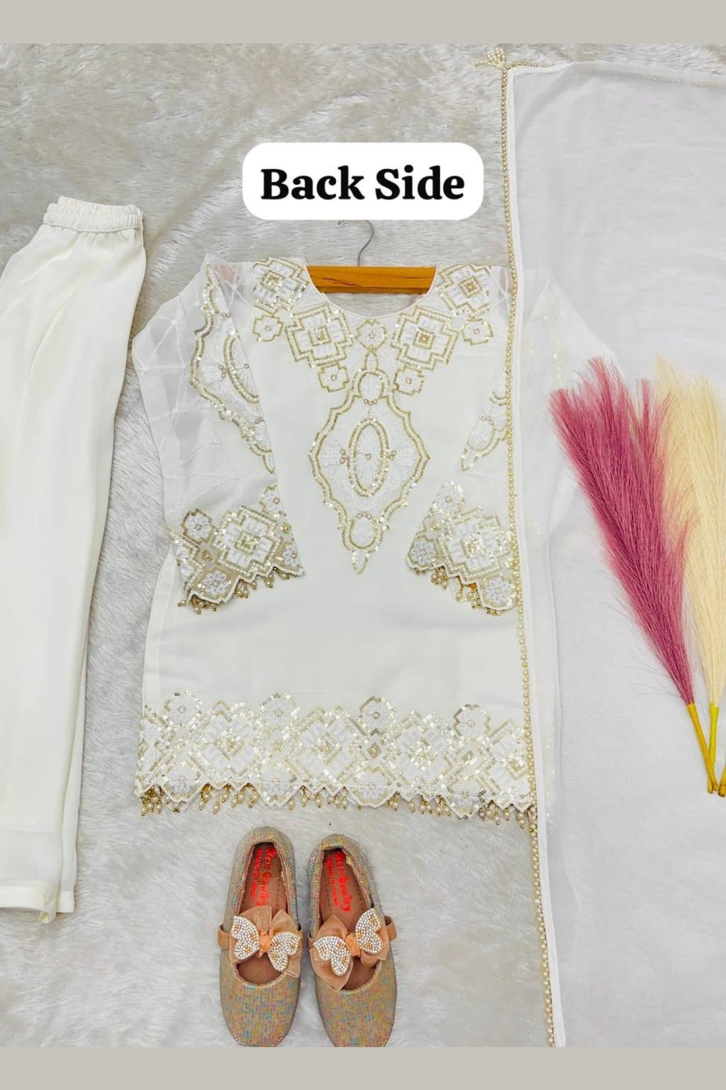 White indian kidswear kurta with palazzo, full length view with georgette dupatta on model.
