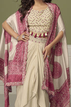 front view of a magenta festive wear for women plazo and blouse set in chinon silk with embroidery and print work.