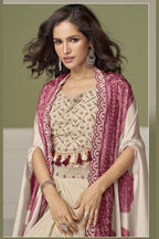 Close-up of a magenta sangeet outfits for women plazo blouse in chinon silk with embroidery and print work on the sweetheart neckline.