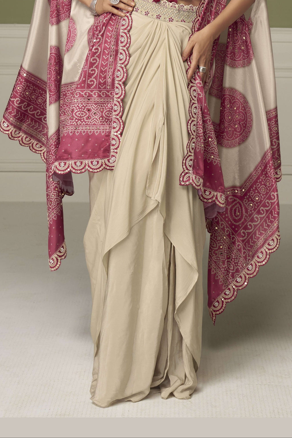 Waist-down view of a magenta indian wedding guest dresses plazo in chinon silk with embroidery and print work on the flared plazo.