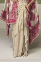 Waist-down view of a magenta indian wedding guest dresses plazo in chinon silk with embroidery and print work on the flared plazo.