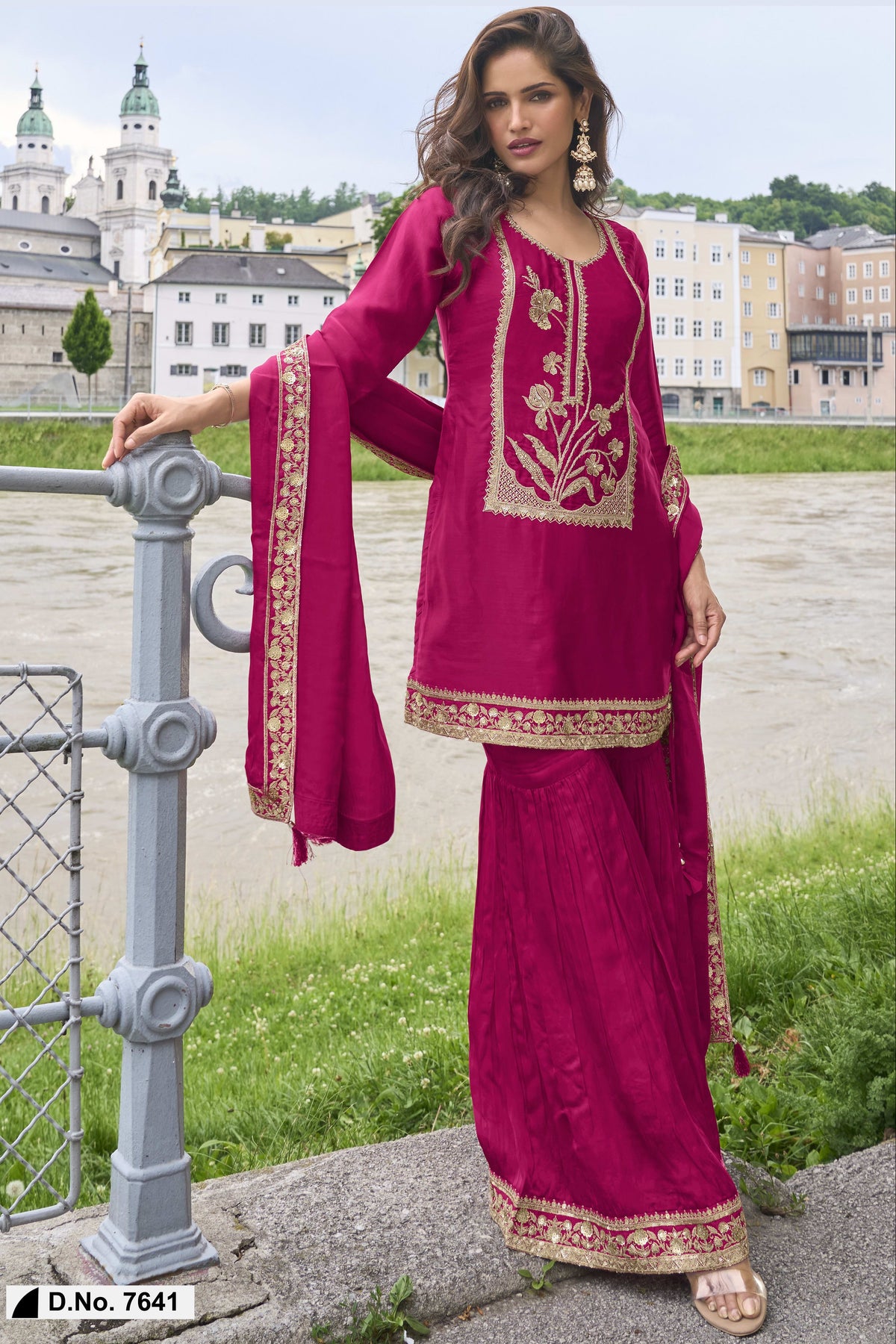 Close-up of the embroidery work on the pure silk kurta of the Reddish Pink indian sharara, showing the embroidery detailing on the pure silk fabric.