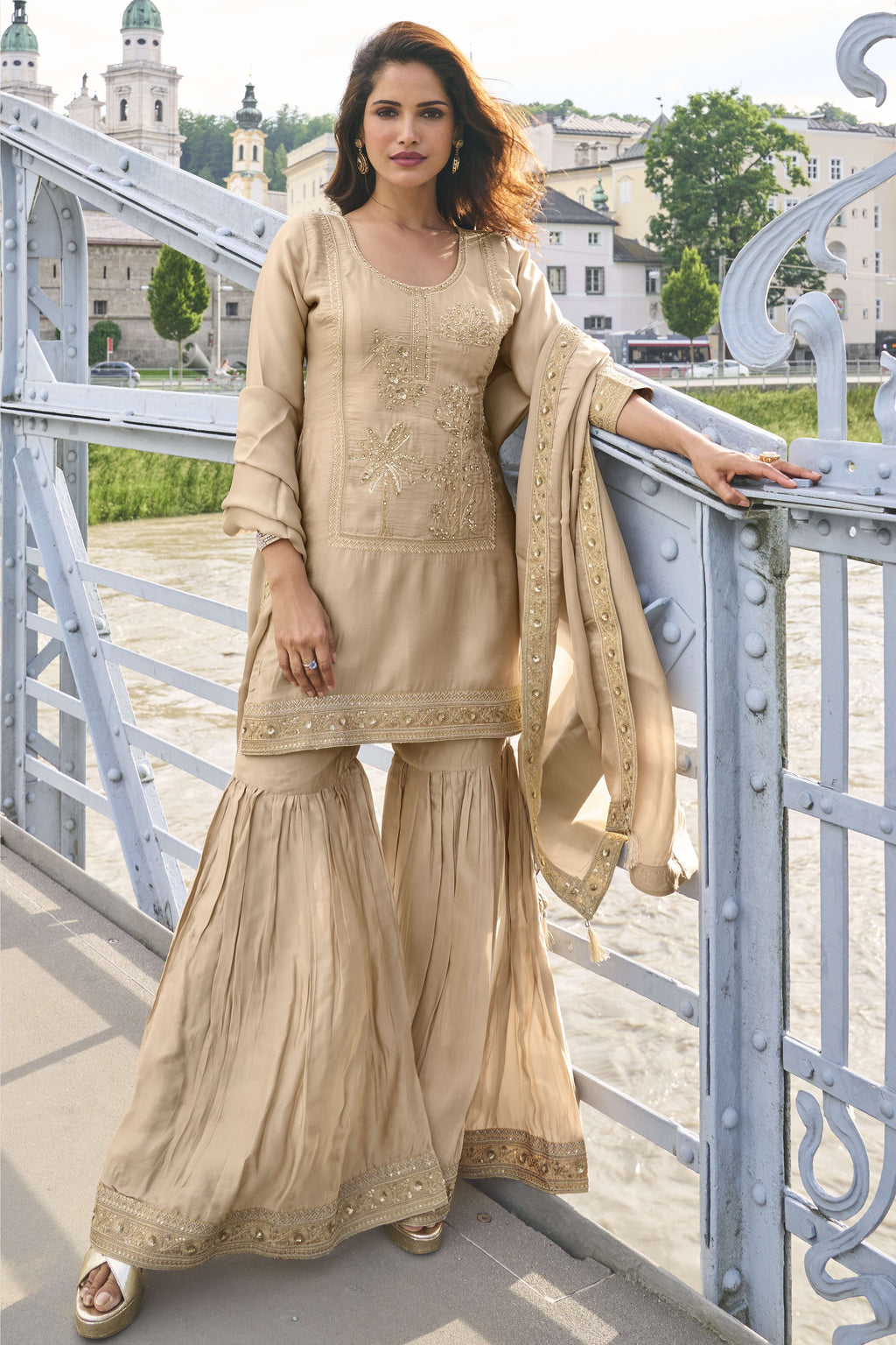 Beige indian sharara with embroidery work on pure silk, shown in a full front view of the kurta, sharara and dupatta.
