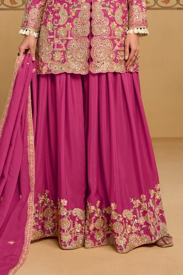Waist-down view of the palazzo and kameez hem of the Magenta palazzo suit for women, displaying the flared palazzo and embroidered kameez hem.