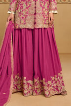 Waist-down view of the palazzo and kameez hem of the Magenta palazzo suit for women, displaying the flared palazzo and embroidered kameez hem.