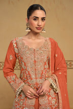 Close-up view of the neckline embroidery of the Rust palazzo suit, showing the embroidered neckline and sleeve detailing on chinon silk.