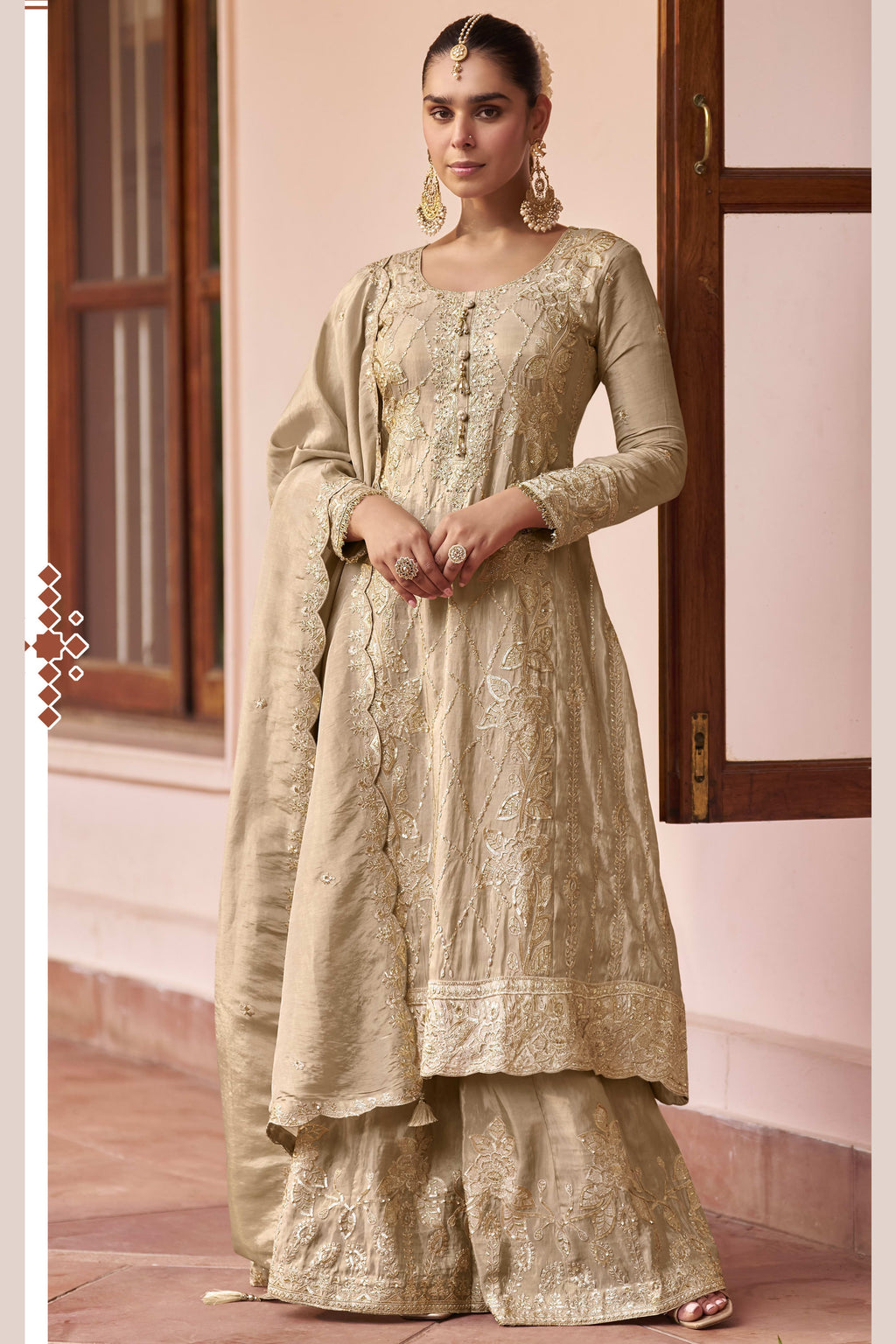 Beige indian palazzo suit with hand work, thread work and sequins embroidery on simmer silk, shown in a full front view of the kurta, plazo and dupatta.