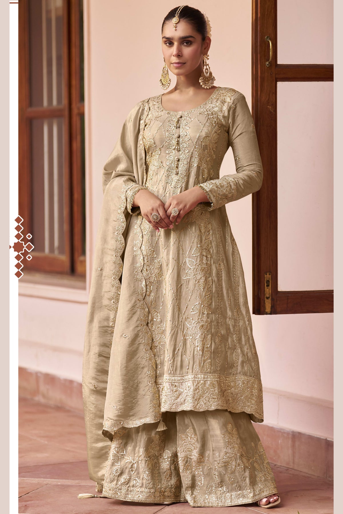 Beige indian palazzo suit with hand work, thread work and sequins embroidery on simmer silk, shown in a full front view of the kurta, plazo and dupatta.
