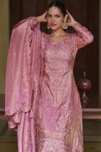 Portrait view of the light pink palazzo kurta set highlighting the hand work and sequins embroidery on the simmer silk neckline.
