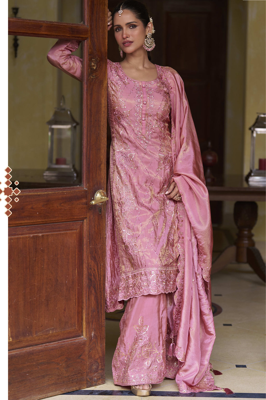 Light pink palazzo suit for women with hand work, thread work and sequins embroidery on simmer silk, in a full front view of the kurta, plazo and dupatta.