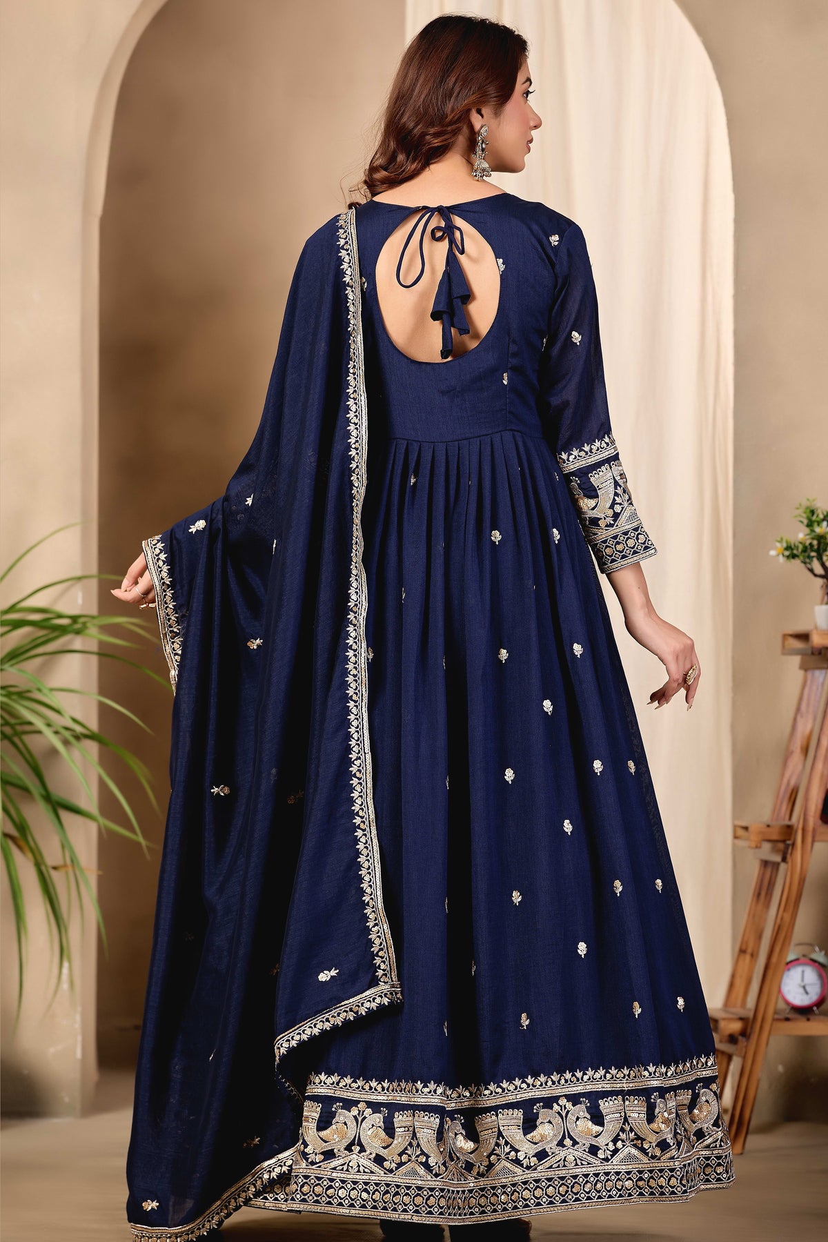 Full-length back view of a navy blue anarkali dress for wedding in art silk with a keyhole back neckline with dori tie, sequin and thread embroidery.