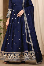 Full-length front view of a navy blue anarkali gown in art silk with sequin and thread embroidery on the bodice and hem, crepe churidar and embroidered dupatta.