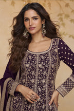 Close-up front view of a purple anarkali suit for wedding in georgette with gold zari floral embroidery, round neckline and embroidered full sleeves.
