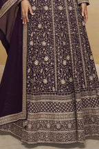Waist-to-hem view of a purple georgette anarkali dress with gold zari floral embroidery, wide embroidered border and matching dupatta.