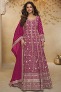 Woman wearing a dark pink georgette anarkali dress with all-over gold zari embroidery and matching dupatta, full-length front view.