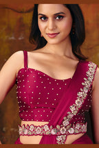 Dark red sequin saree blouse closeup showing sequin and pearl embroidery detail