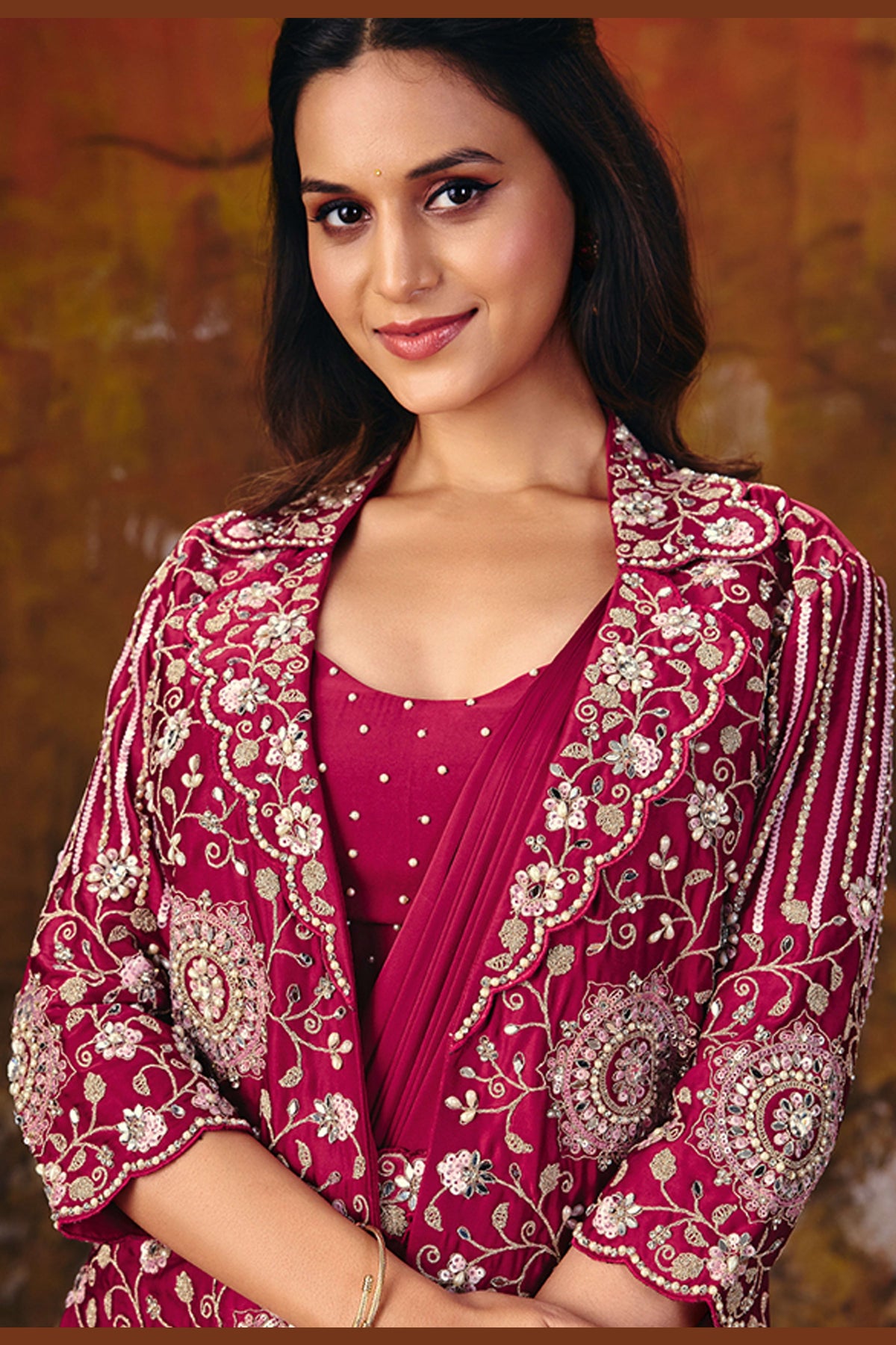 Back view of dark red sequin saree jacket with embroidered medallion detail
