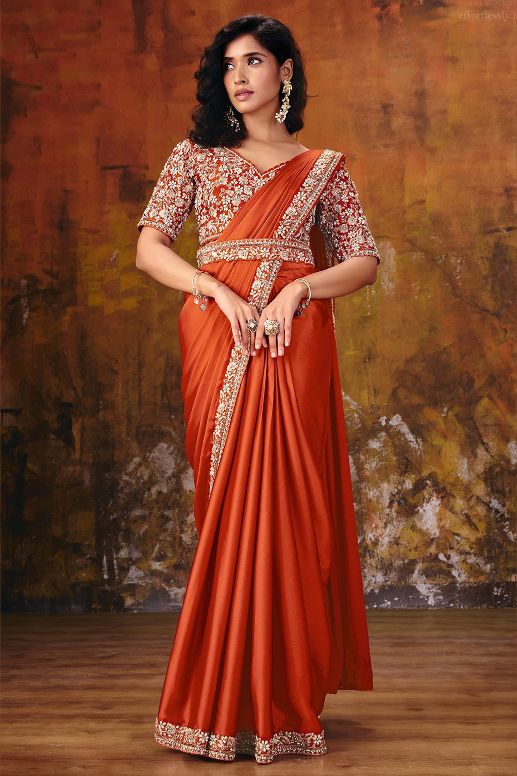 Rust satin silk party wear saree with sequin embroidery, model in full front view