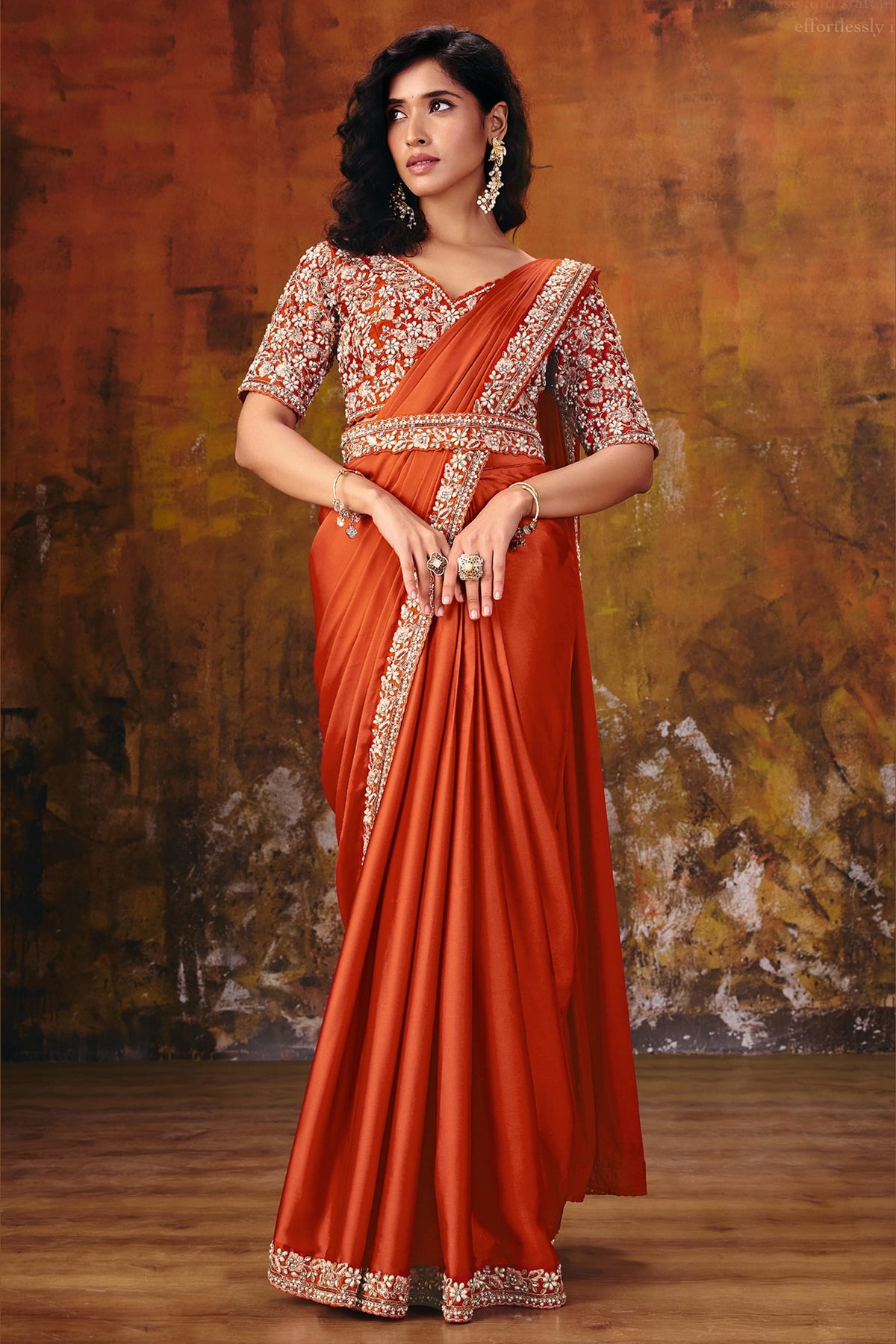 Rust satin silk party wear saree with sequin embroidery, model in full front view