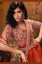Rust saree for party closeup showing sequin and stone work on the blouse