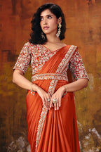 Rust sequin saree drape detail with embellished border
