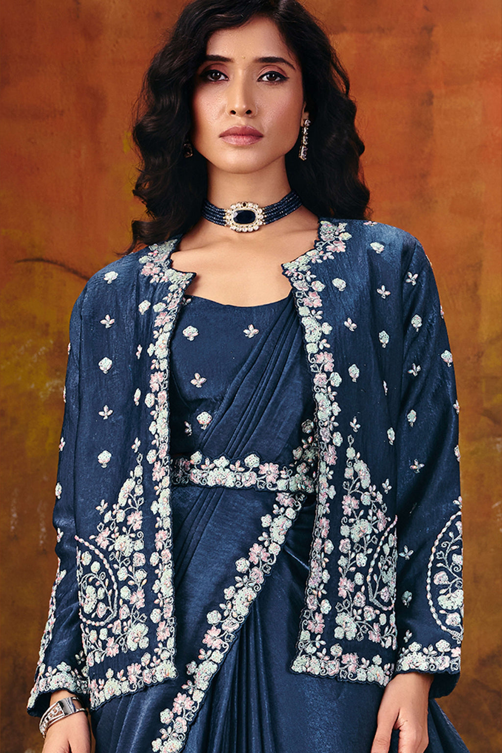 Designer navy blue saree drape closeup showing sequin border