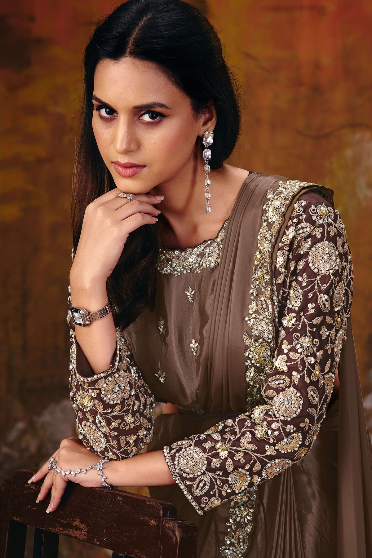 Brown embroidered saree blouse closeup with sequin embroidery detail