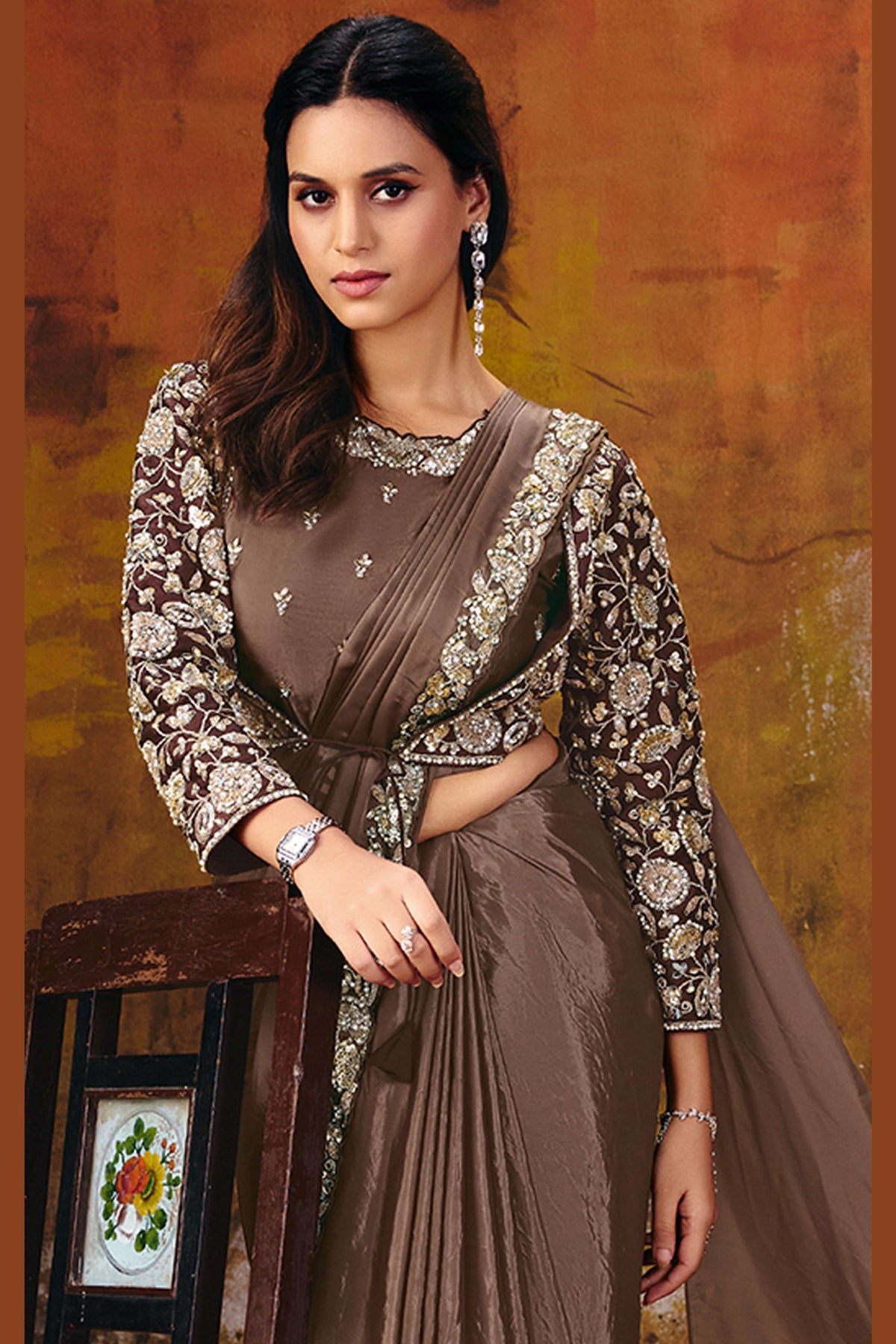 Brown satin silk saree drape closeup showing two-tone sheen