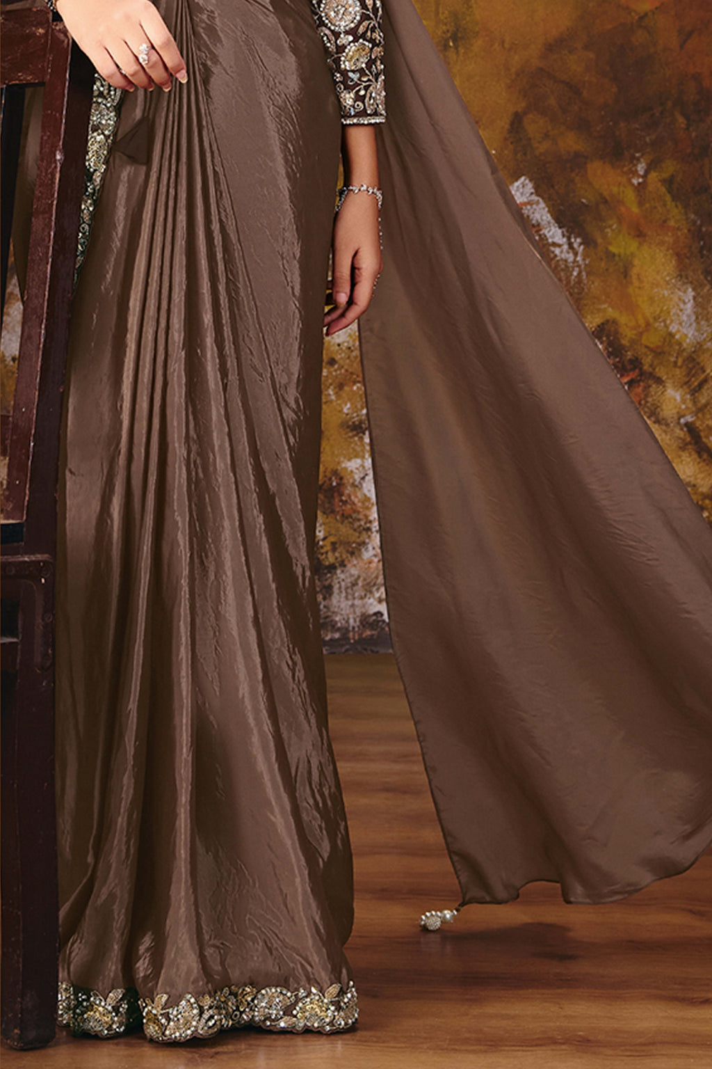 Brown embroidered saree back view showing blouse detailing