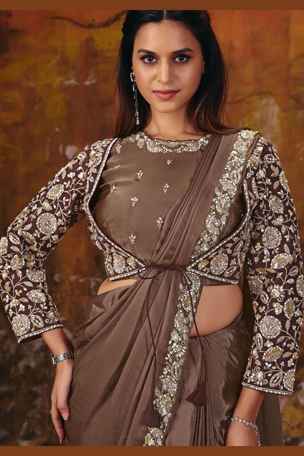 Brown saree for reception closeup of pearl and stone border work