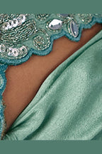 Sea green sequin saree full view with flowing pleated pallu