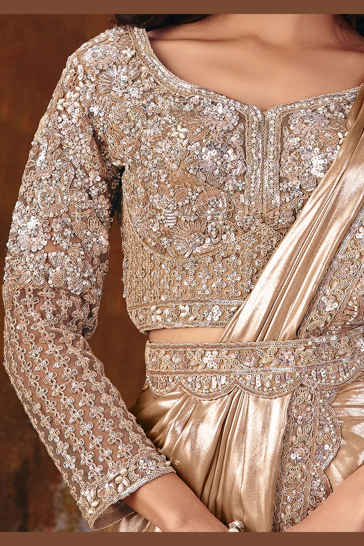 Champagne golden sequin saree side view with flowing foil satin drape