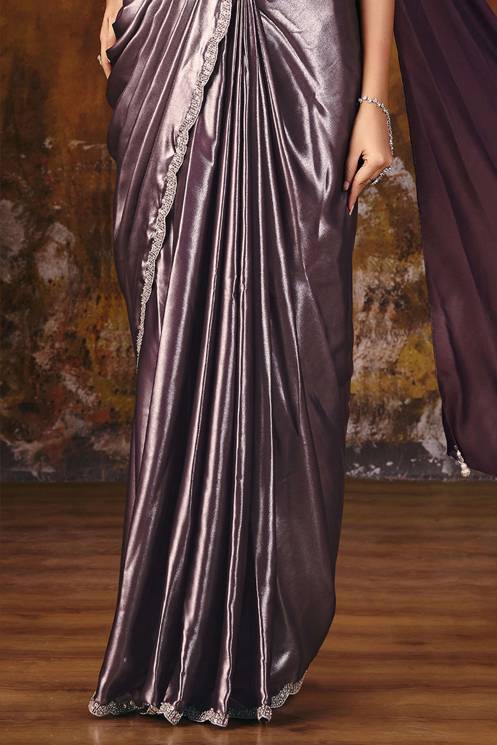 Mauve satin silk saree side view with flowing foil satin drape