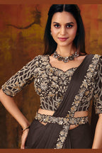 Dark brown embroidered saree blouse closeup with sequin and pearl work