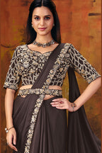 Dark brown designer saree drape detail with embellished border