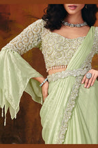 Designer mint green saree side view with flowing two-tone drape