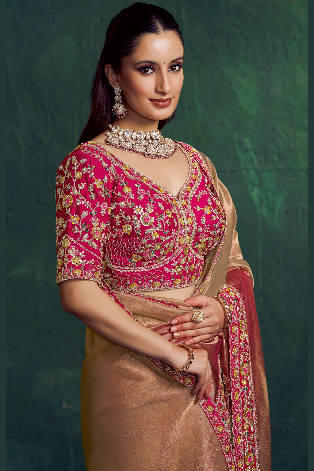 Hot pink saree for wedding with bead and embroidery work, full front view of the model wearing the draped saree
