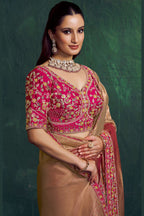 Hot pink saree for wedding with bead and embroidery work, full front view of the model wearing the draped saree