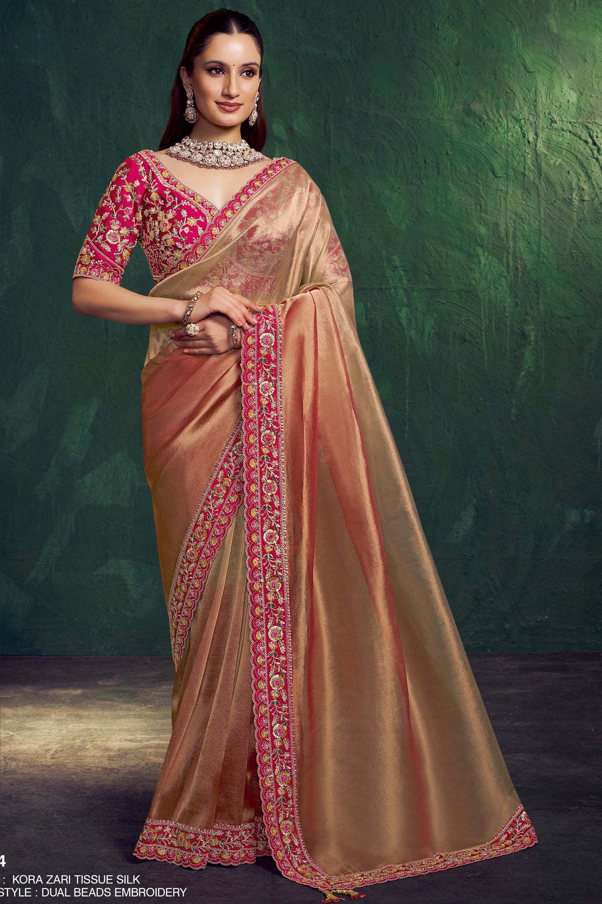 Hot pink sequin saree, front view showing the embellished blouse and shimmering pallu drape