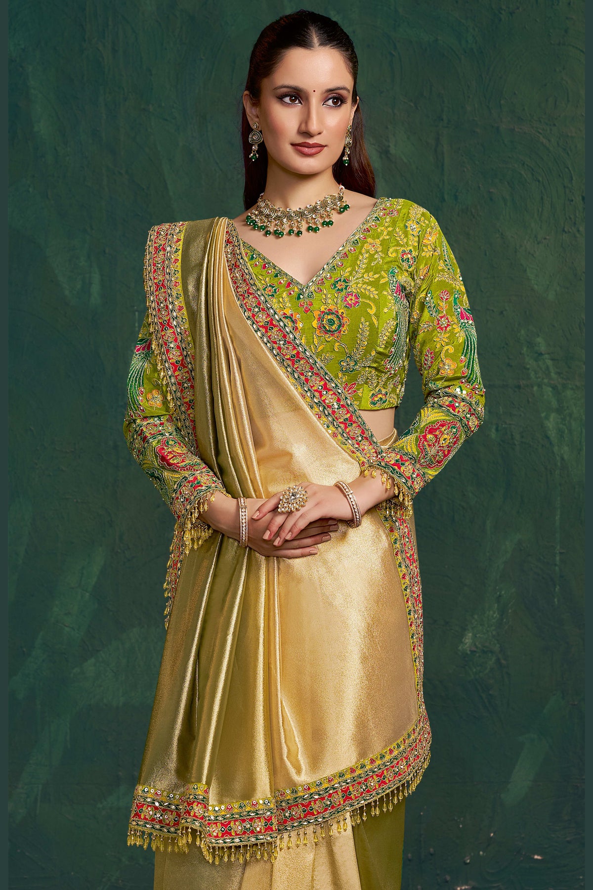 Yellow green saree for wedding, front view showing the zari border and floral motif embellished blouse