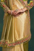 Yellow green party wear saree, waist-down view of the pleats and shimmering tissue silk drape