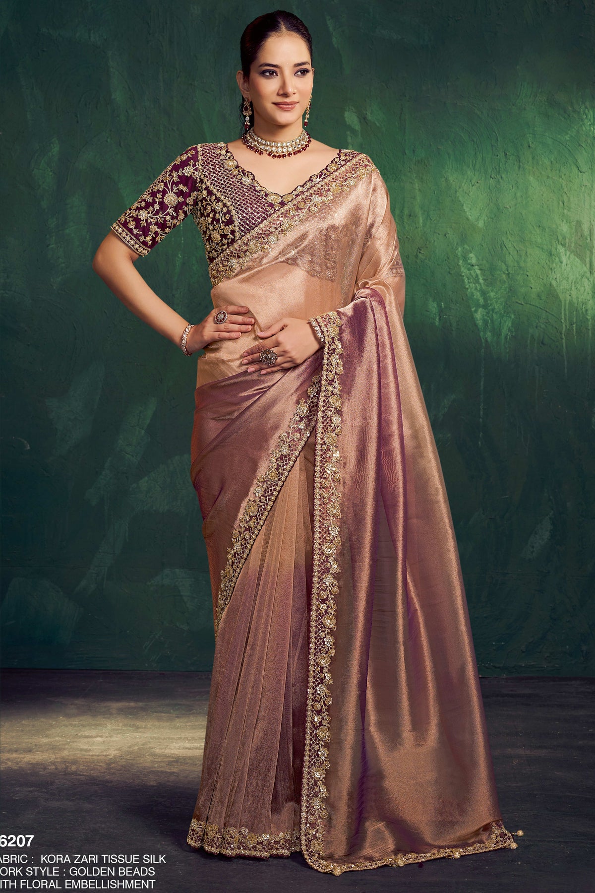 Brown designer saree with golden bead work and floral embellishment, full front view of the draped saree