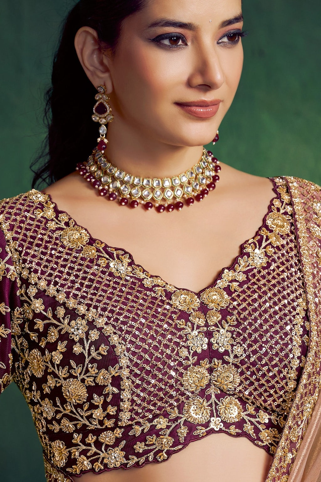 Brown sequin saree, upper-body closeup of the floral embellishment and bead work detail