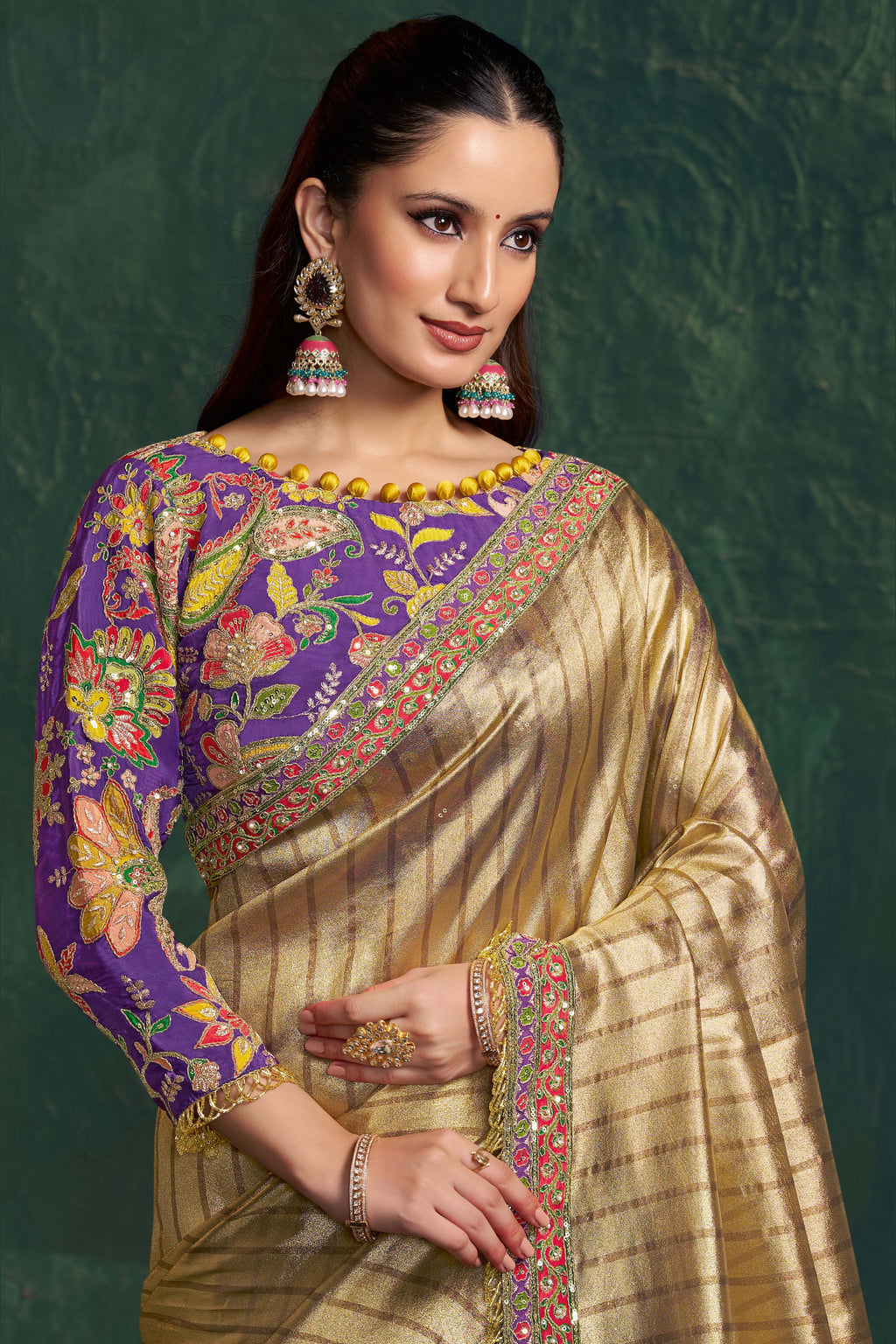 Champagne golden designer saree, upper-body closeup of the floral motifs and zari work detail