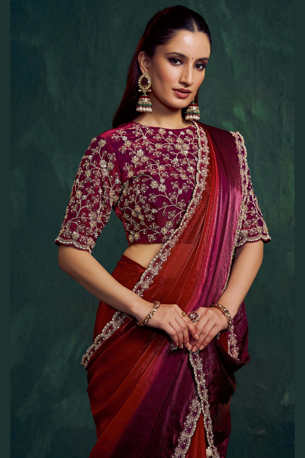 Maroon saree for wedding, front view showing the embellished satin silk blouse and shaded drape