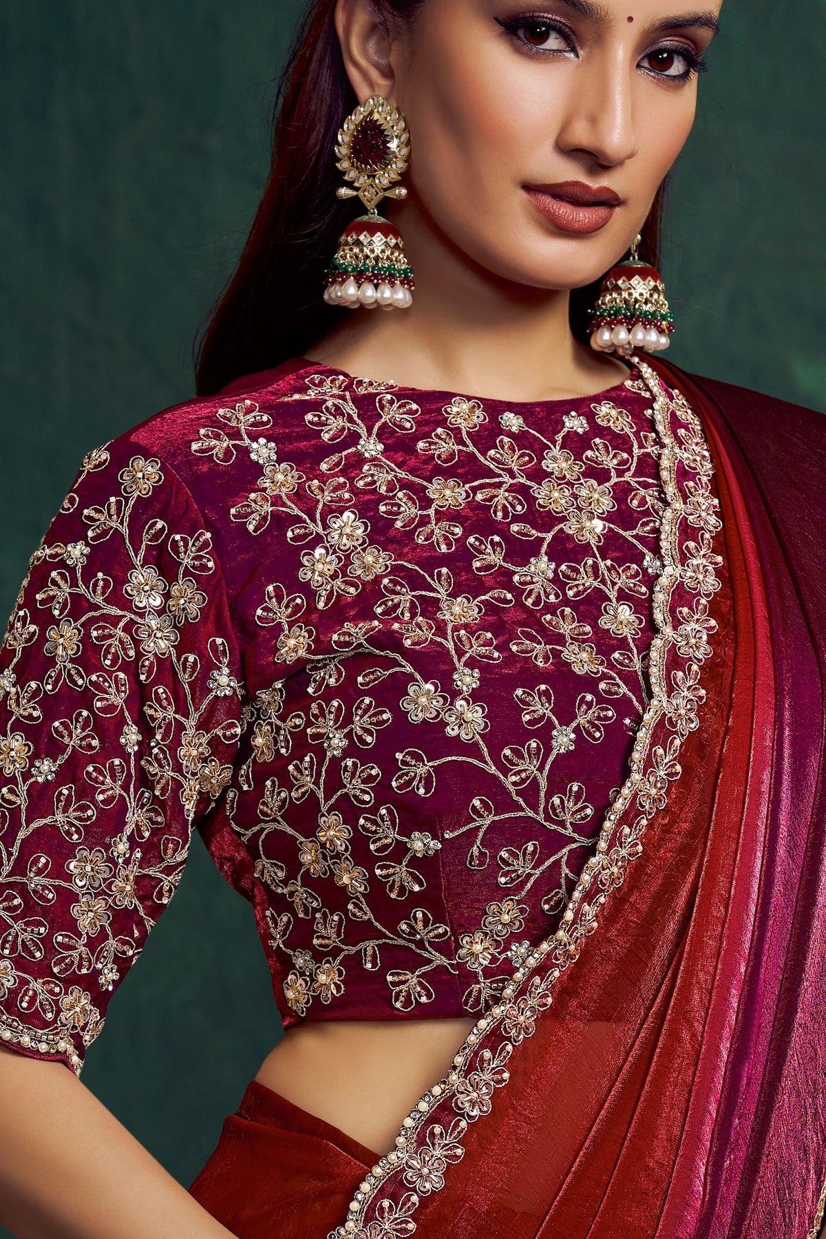Maroon embroidered saree, upper-body closeup of the bead work and sequin embroidery detail