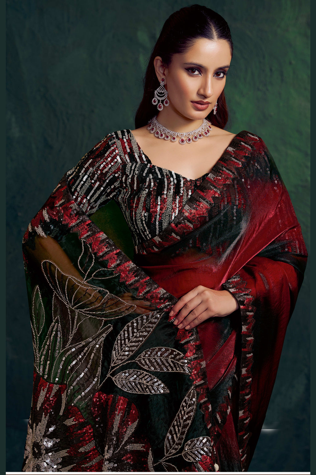 Red sequin saree, front view showing the embellished satin silk blouse and shimmering drape