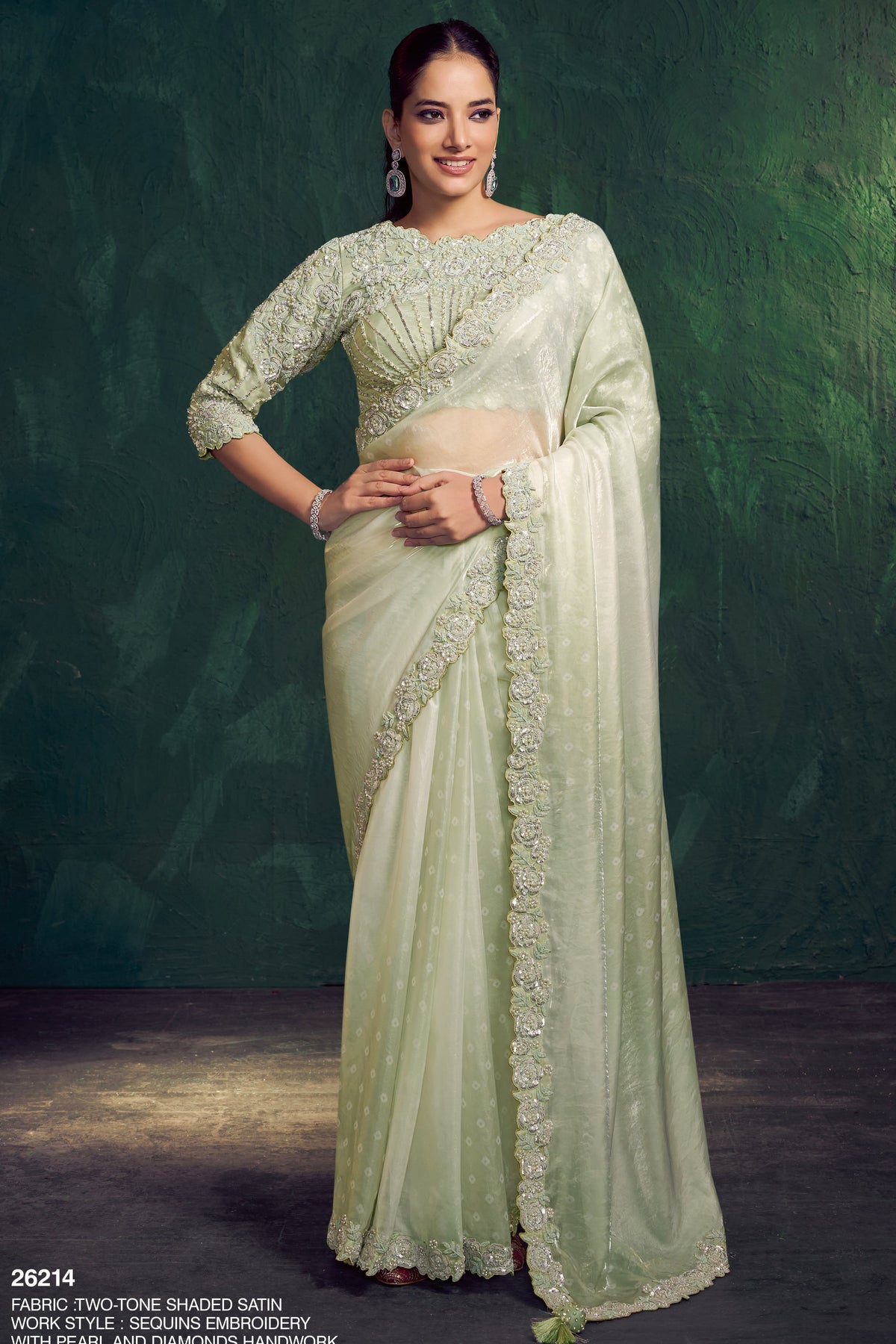 Mint green saree for diwali with sequin embroidery, pearl and diamond work, full front view of the draped saree