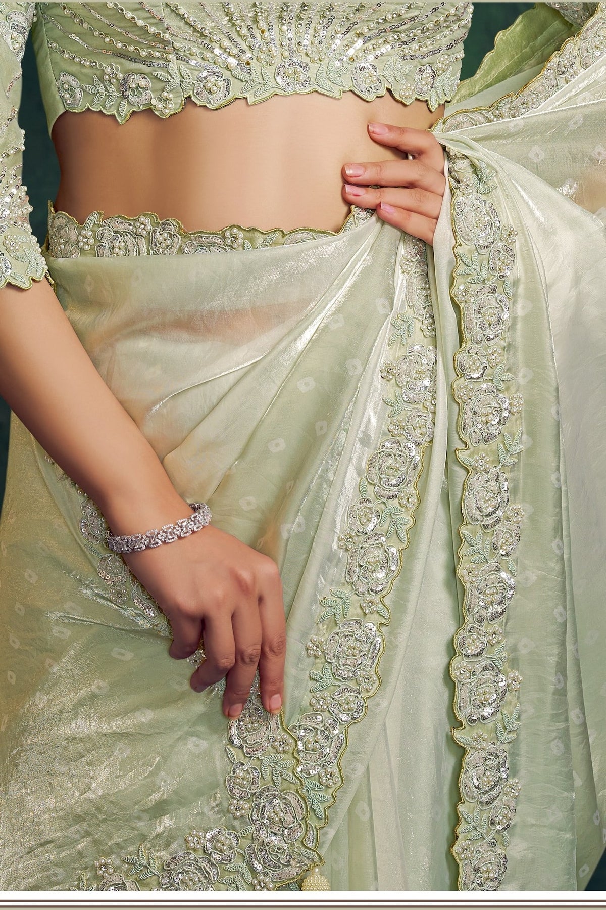 Mint green embroidered saree, waist-down view of the two-tone shaded satin pleats and drape